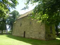 Oblique view of back and left external walls of Saxon Church, Saxon Green, Escomb July 2016